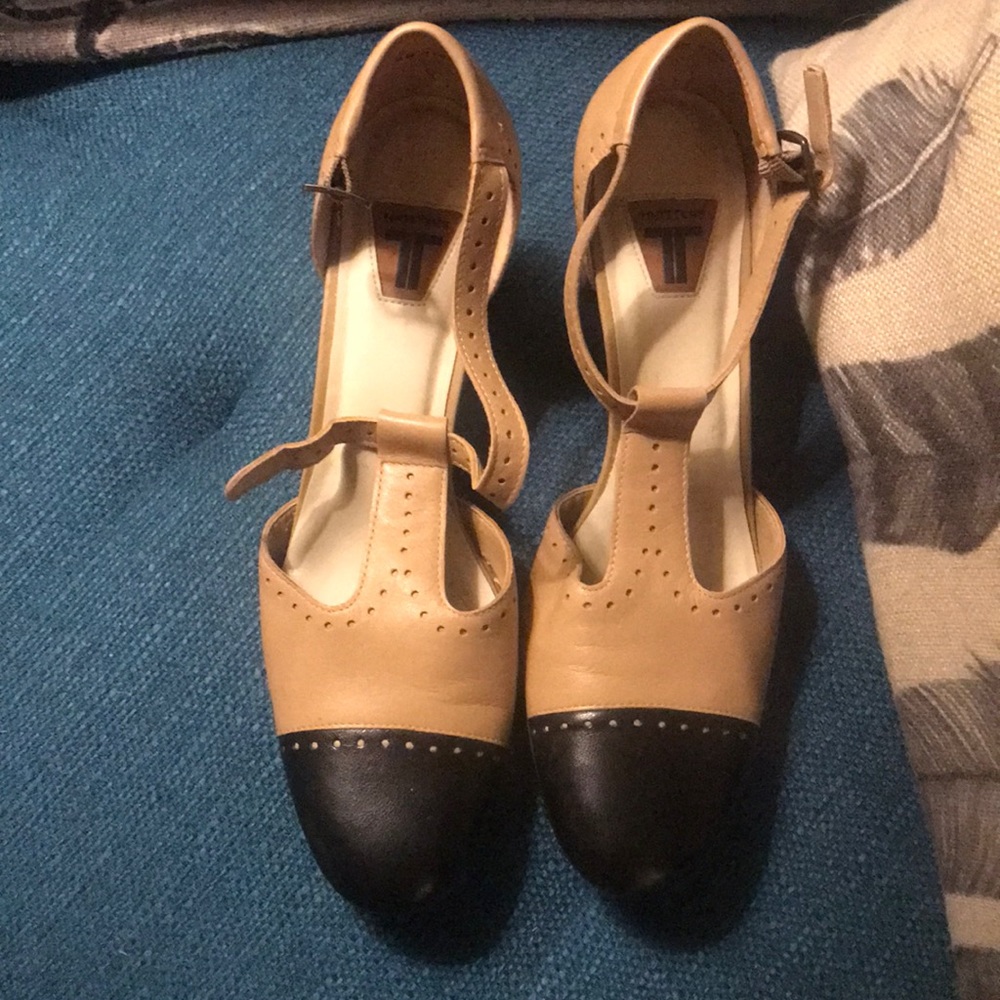 Classic Black and Tan Trotter t-strap shoes.